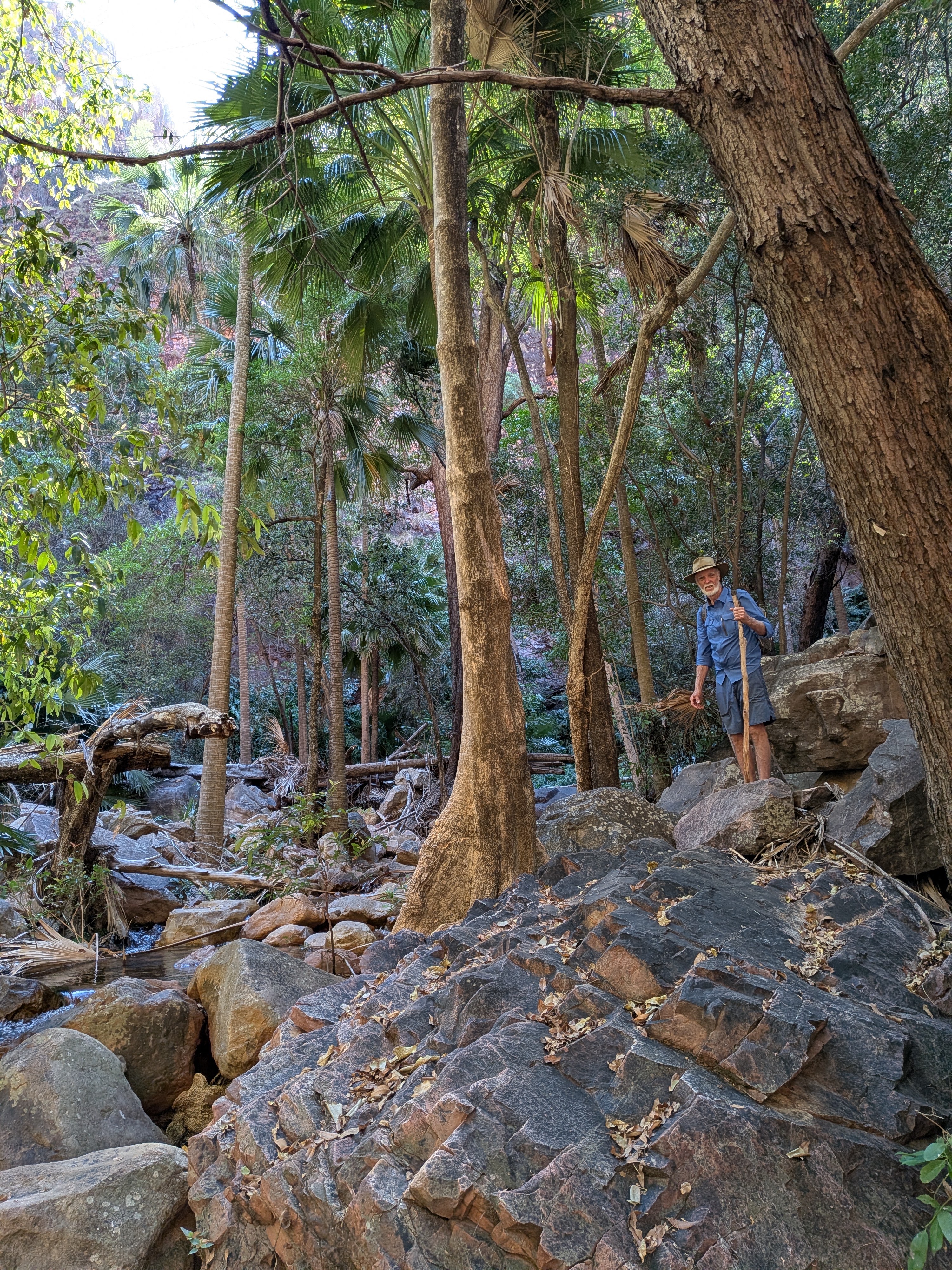 Gordon and his walking stick among the boulders