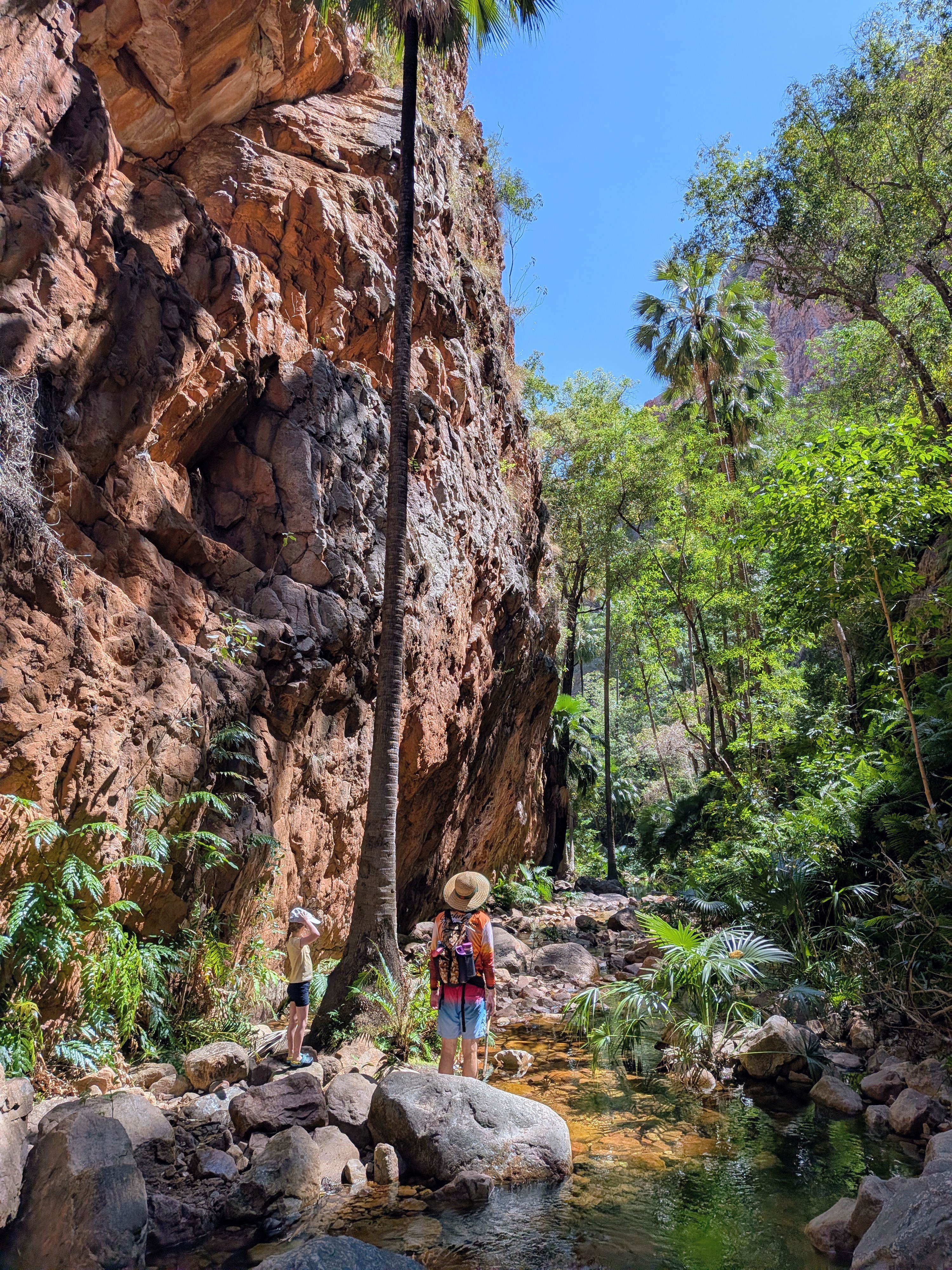 Dylan and Leah dwarfed by the gorge wall