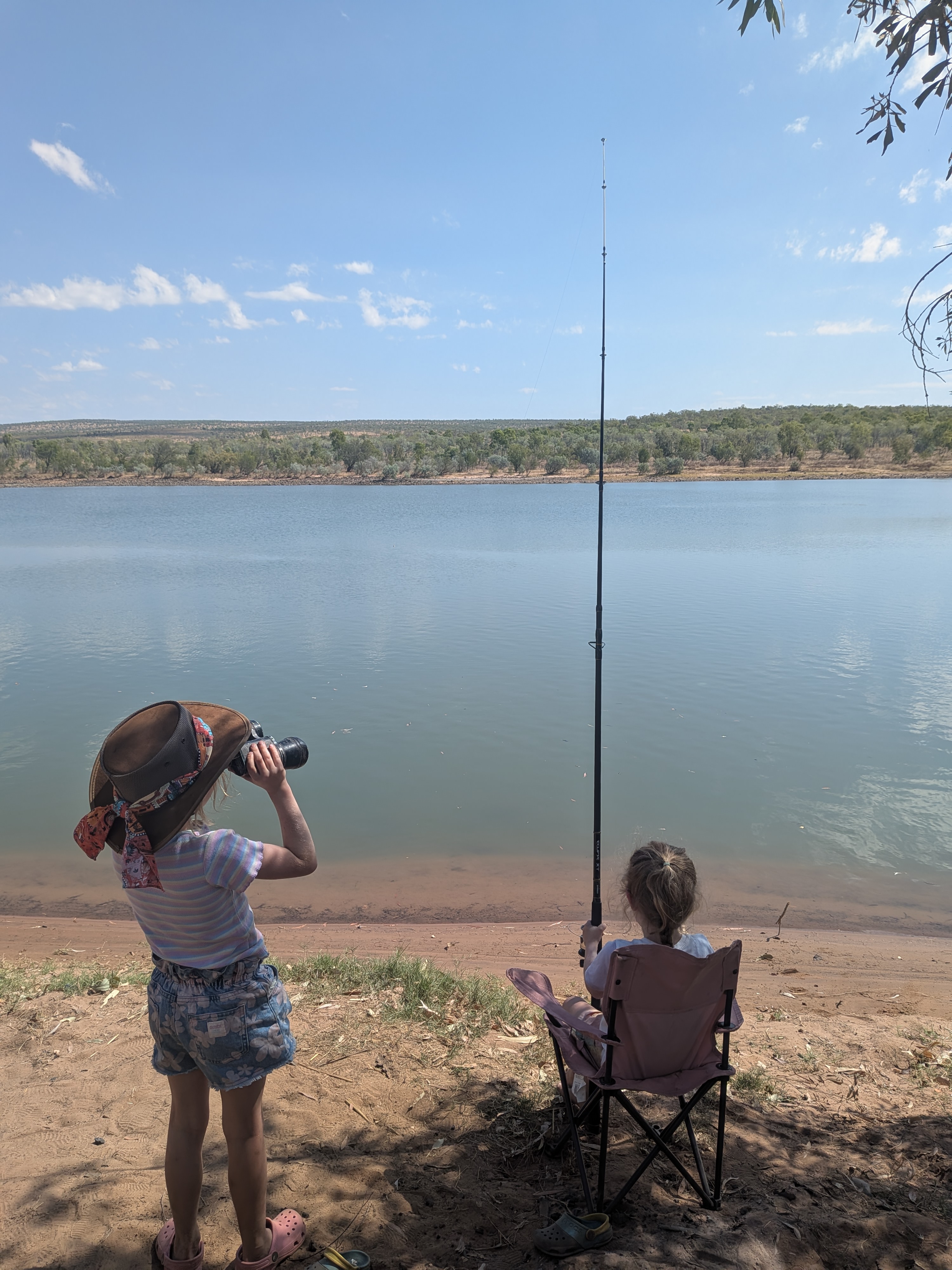 Watching the crossing &mdash; Hazel on binoculars, Leah minding the rod
