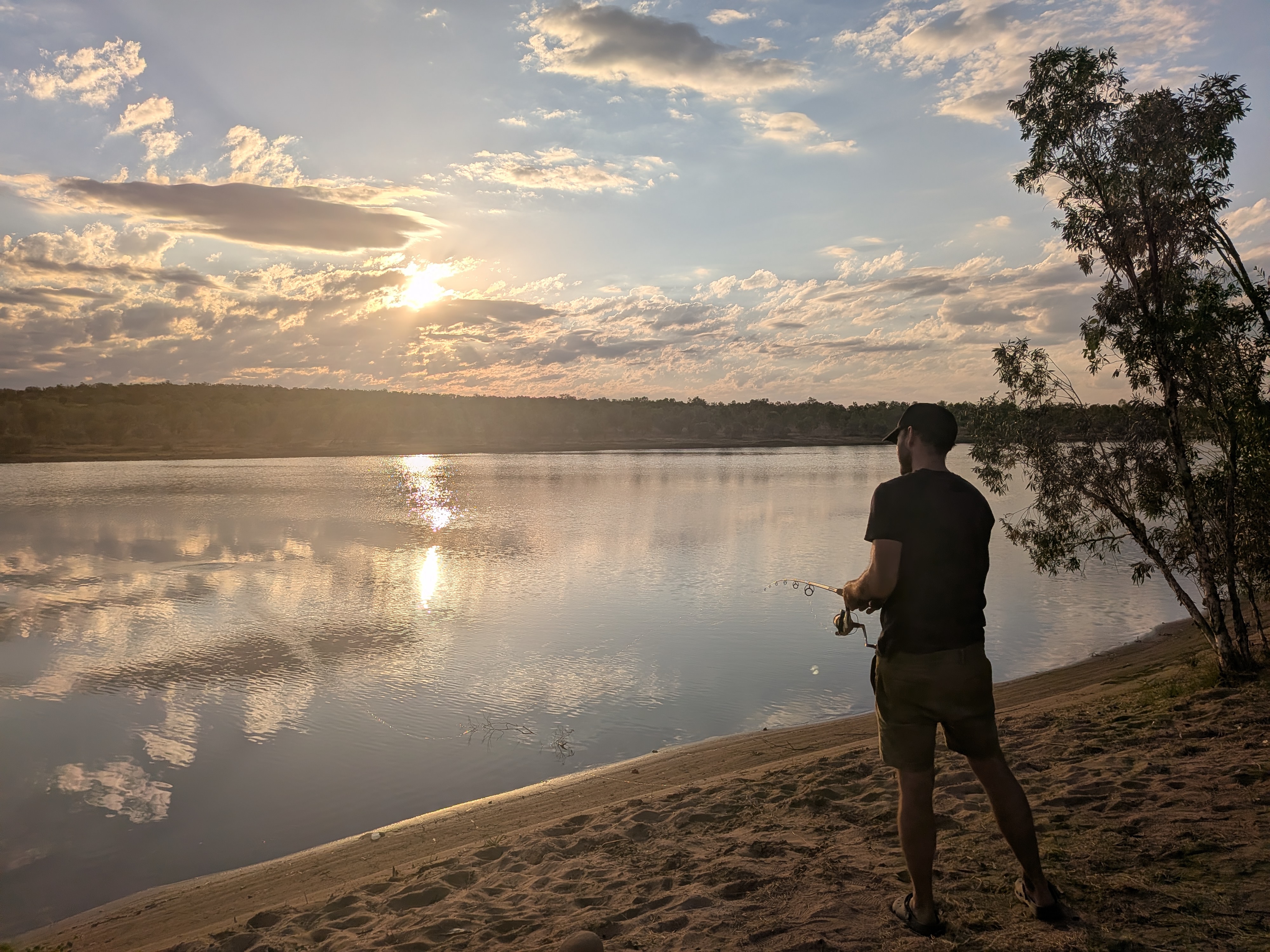 Dylan casting at sunset