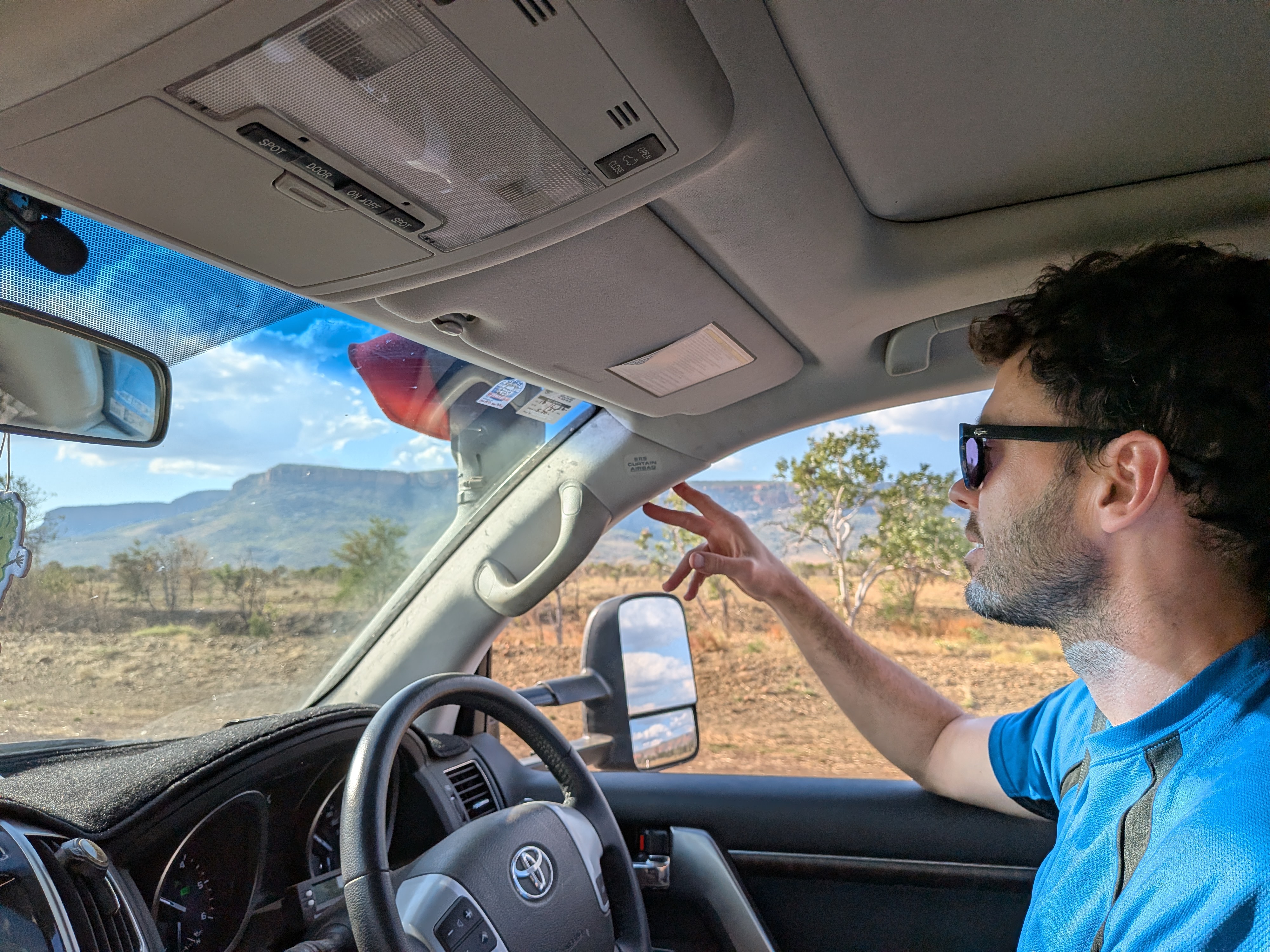 Dylan pointing out the Cockburn Range on the drive home