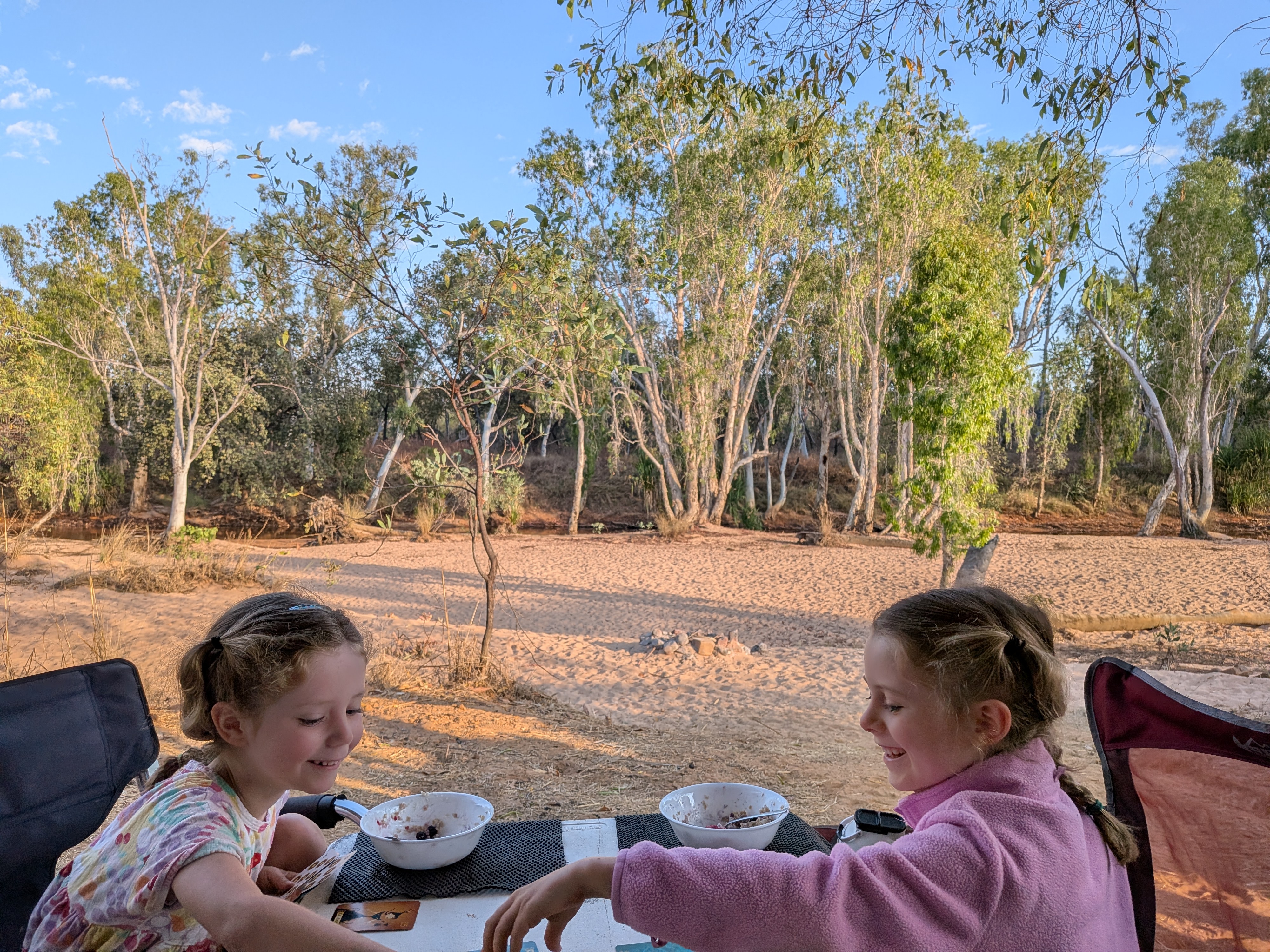 Breakfast and cards on the sand in the morning gold