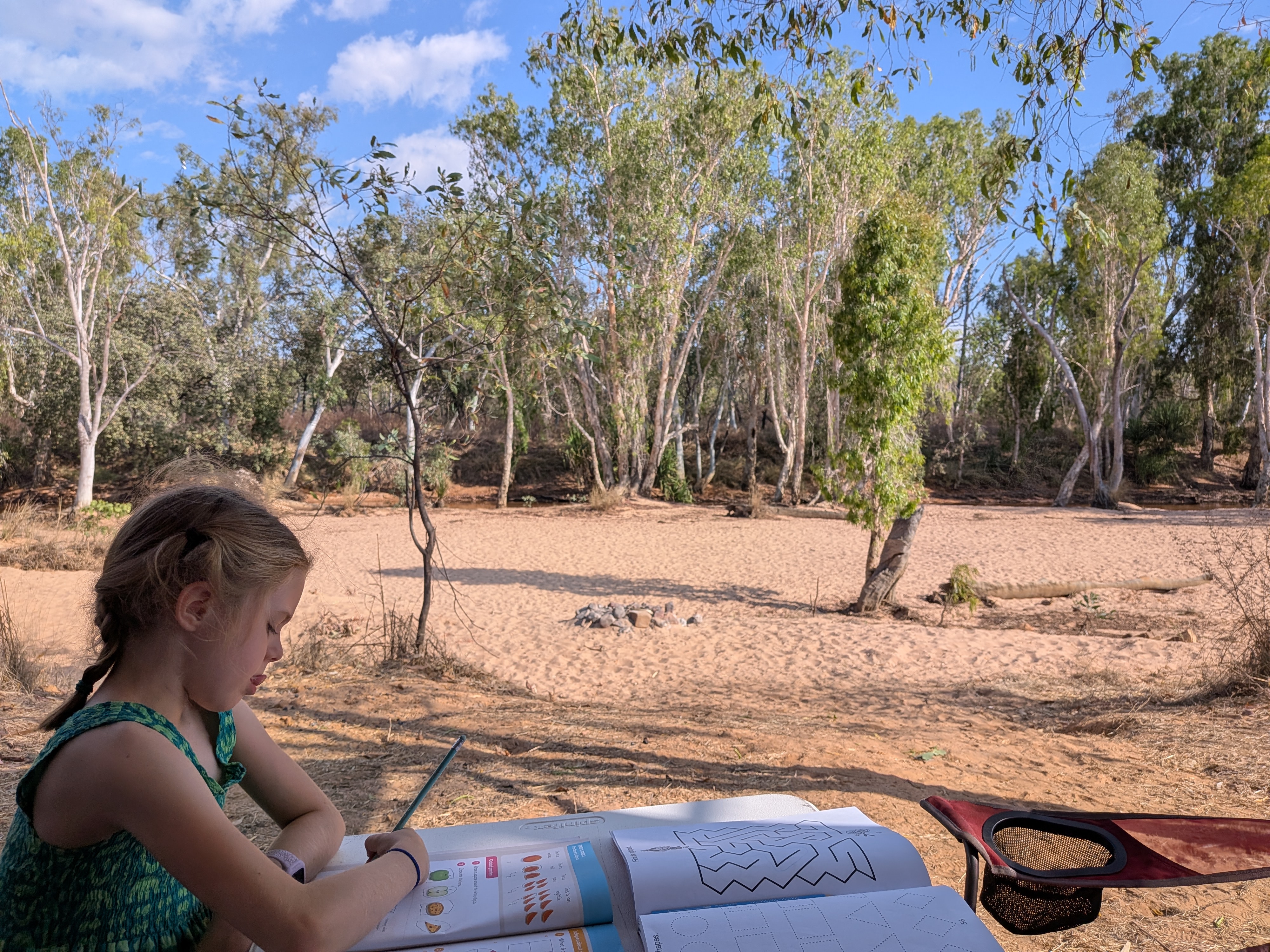 Leah hard at her school work, office views included