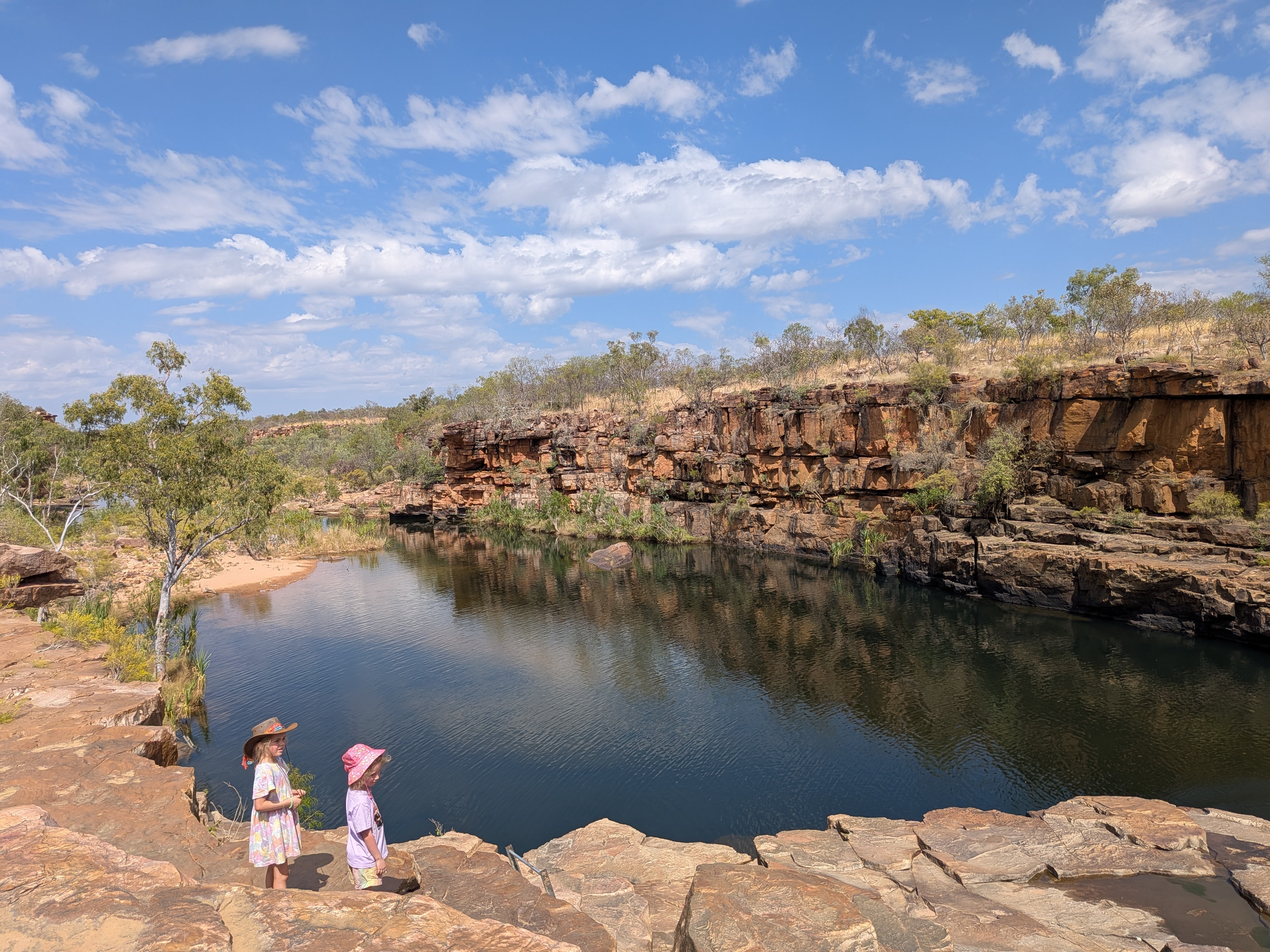 The girls above the dark water of Wunnumurra