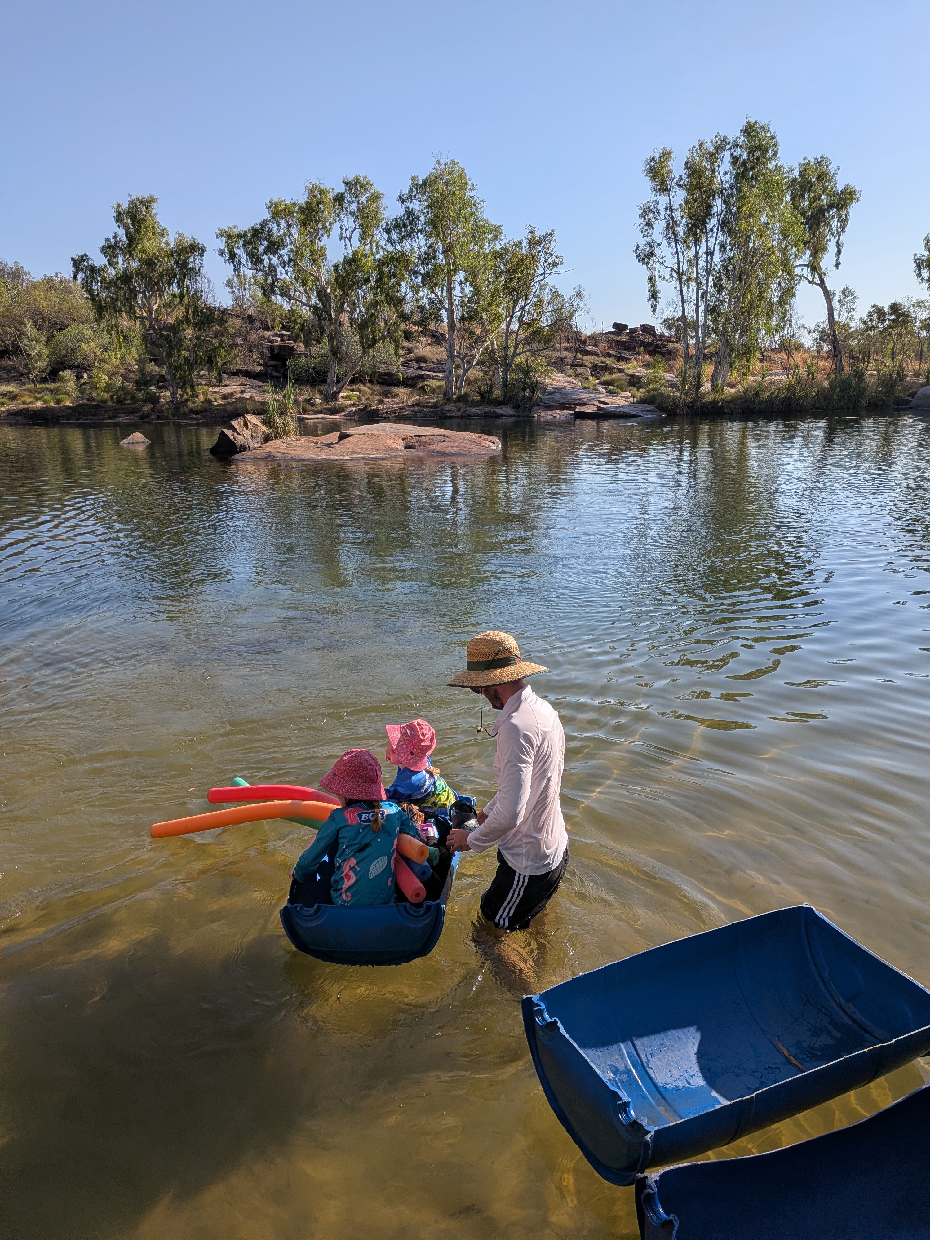 The Manning crossing &mdash; Dylan pushing the girls across in a blue barrel