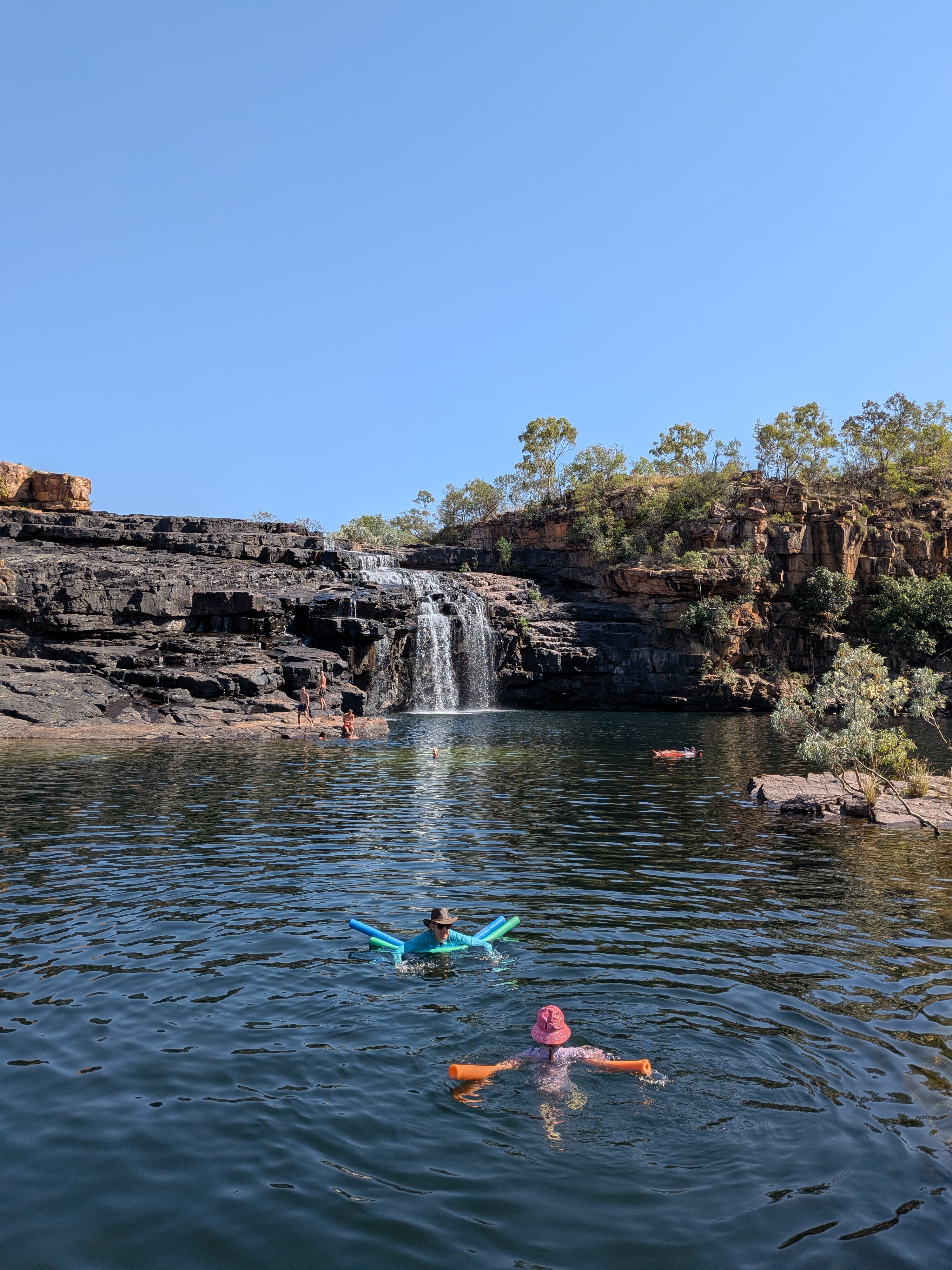 Tricia and Leah, noodles deployed, heading for the falls