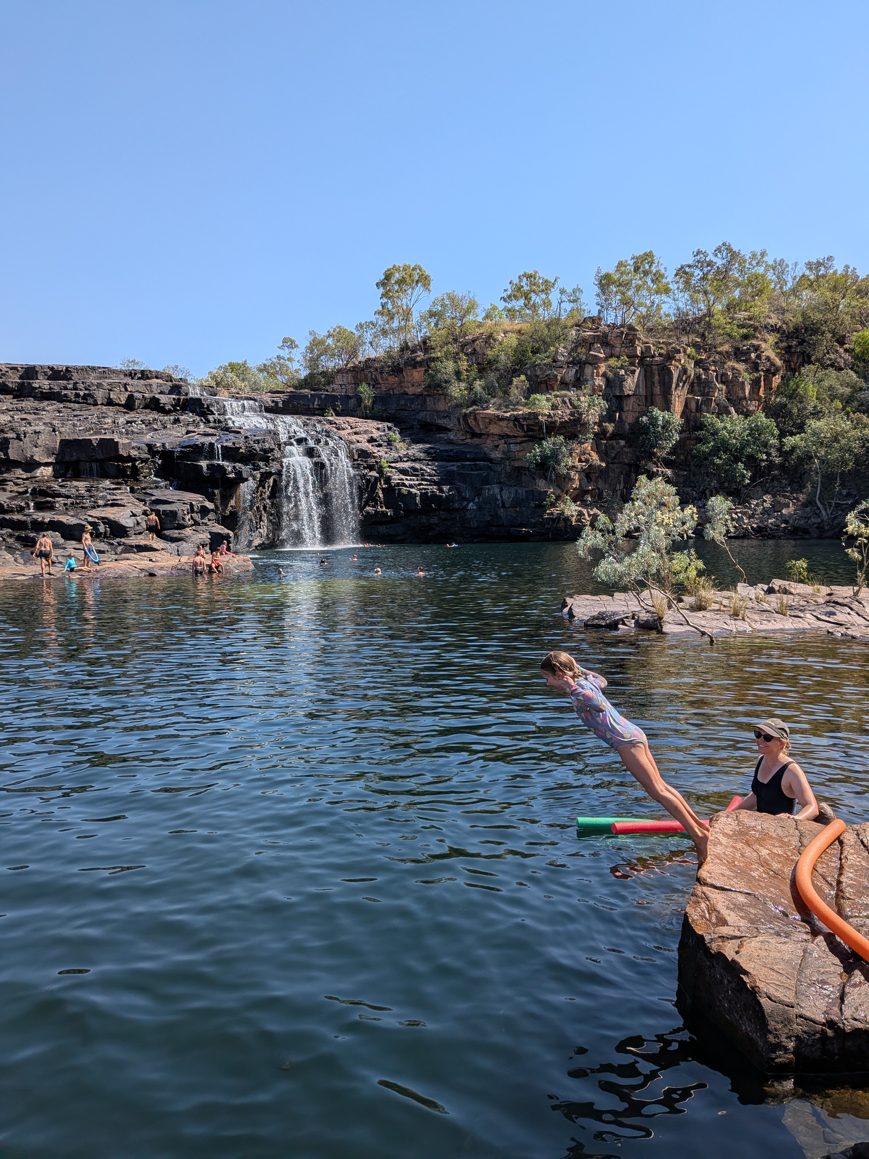Hazel launching off the rocks, Erin on watch