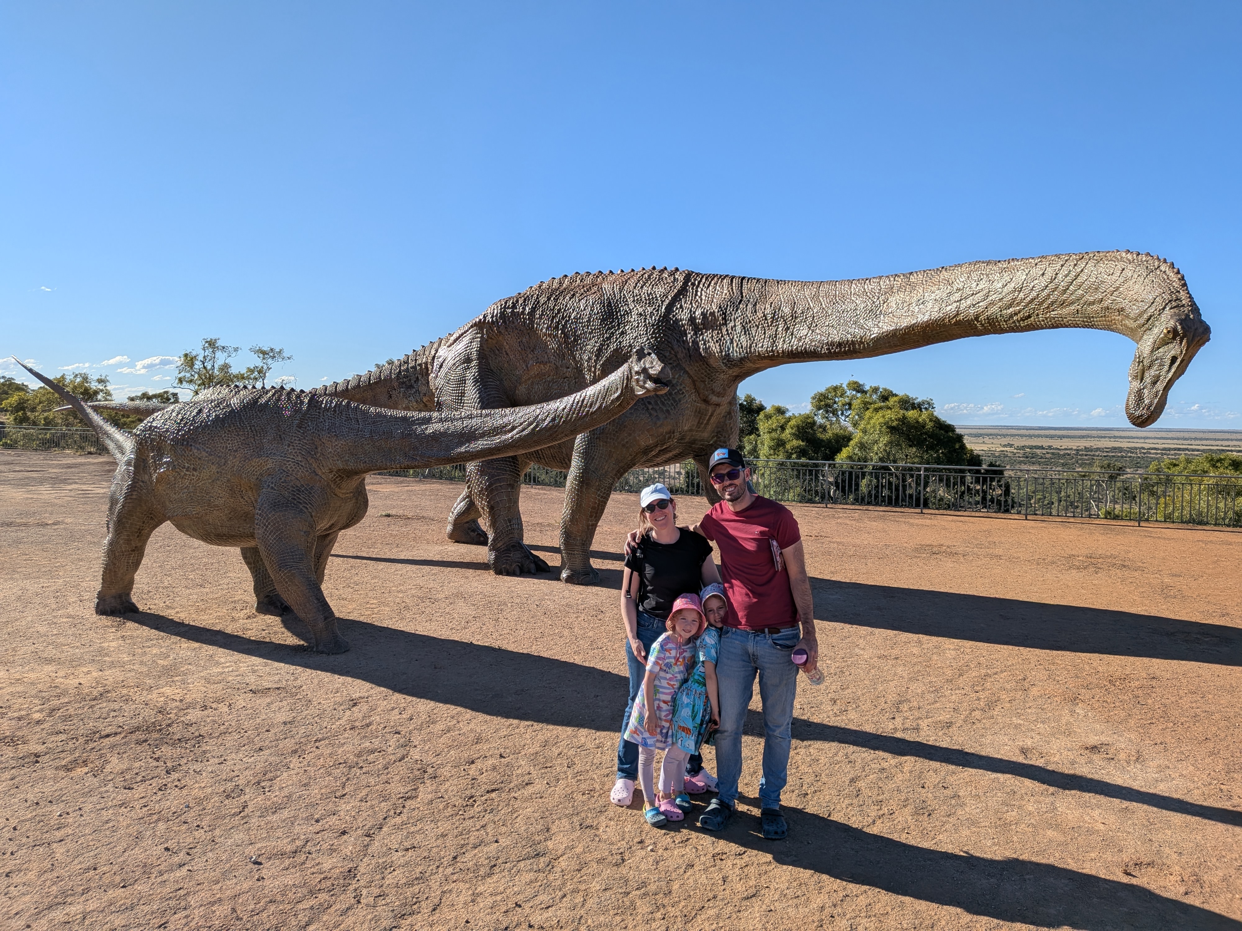 Family photo with the life-size dinosaur sculptures