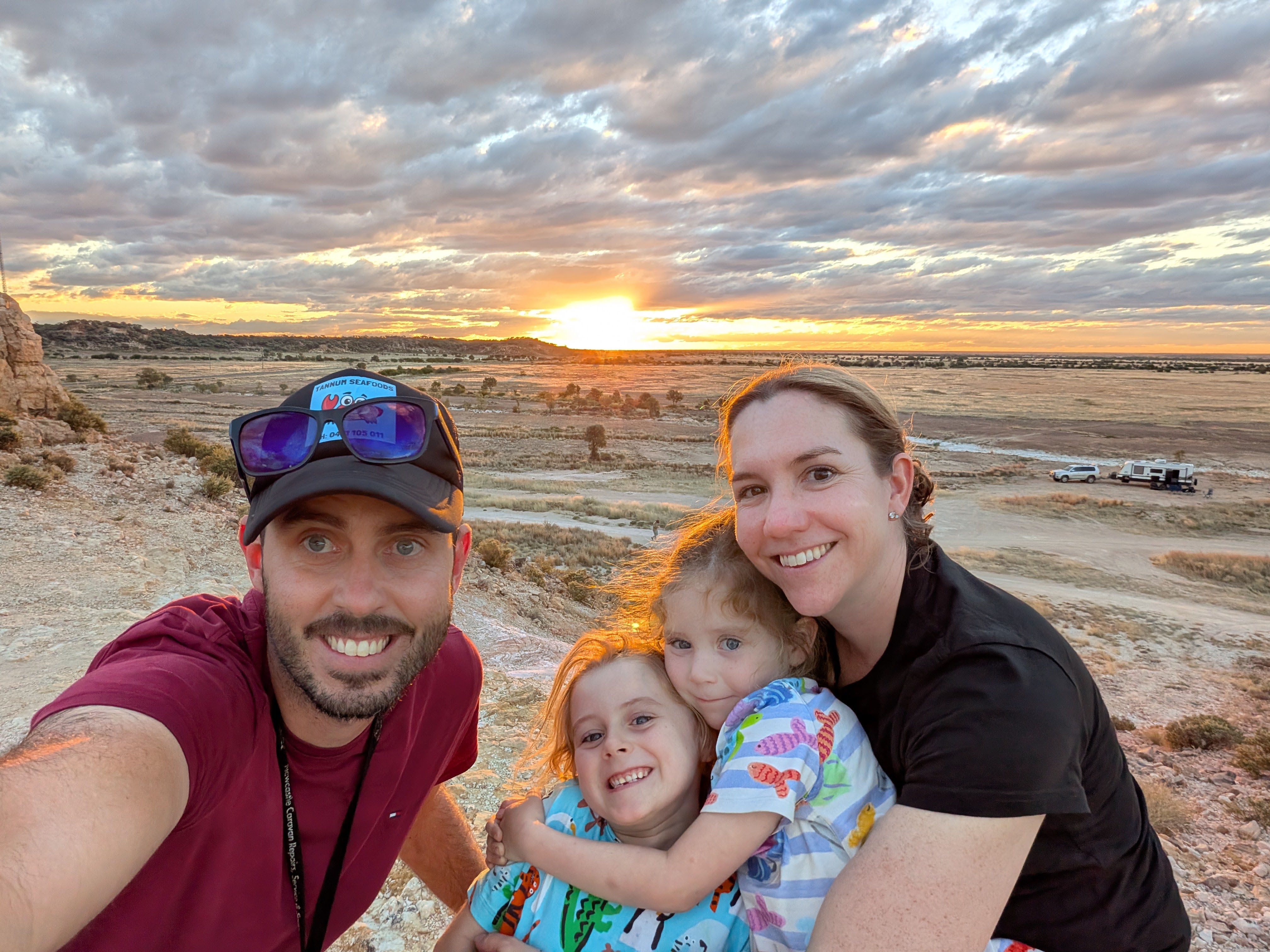 Family selfie at sunset over the plains at Dinosaur Creek
