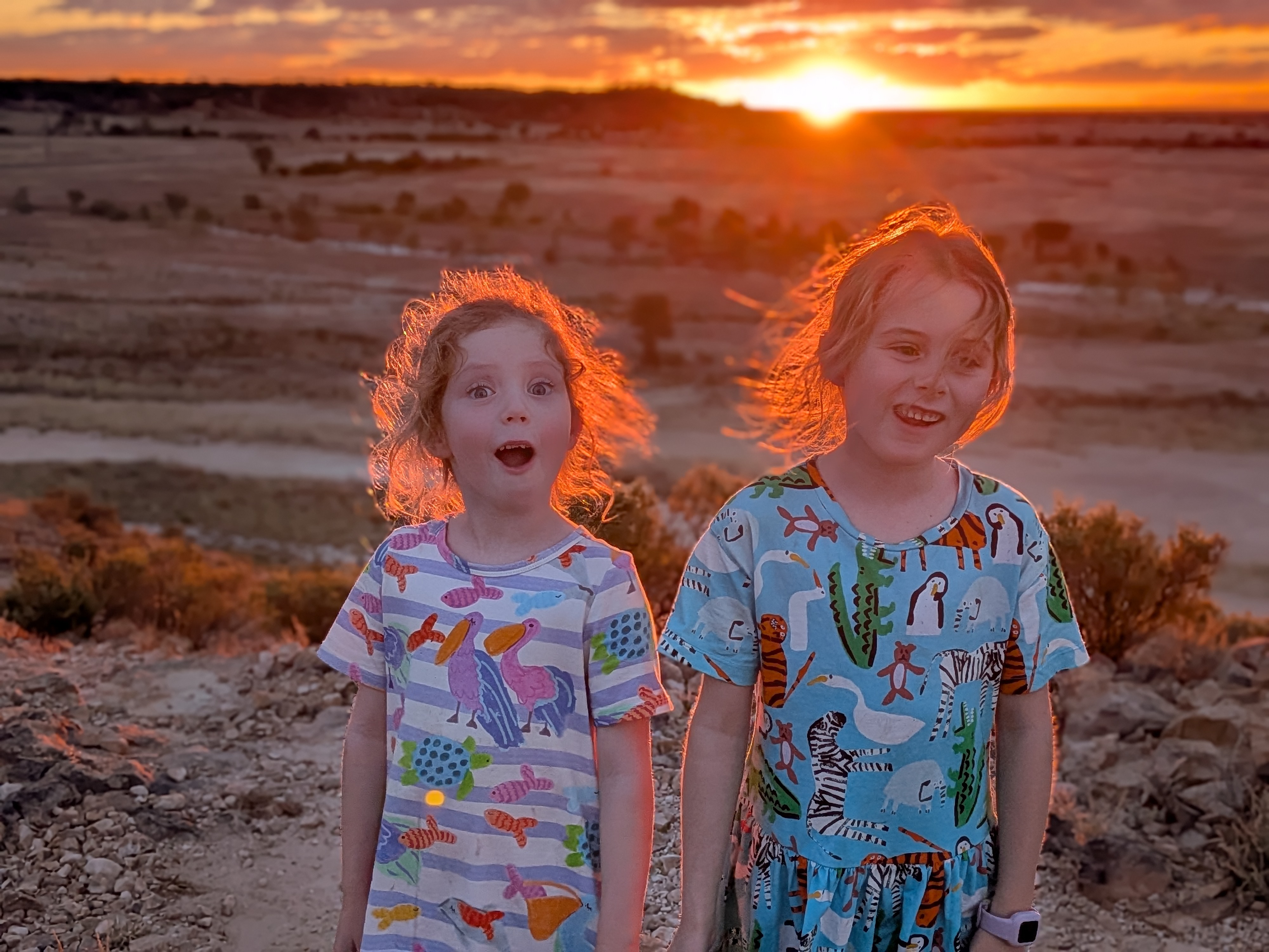 Leah and Hazel glowing in the sunset light at Dinosaur Creek