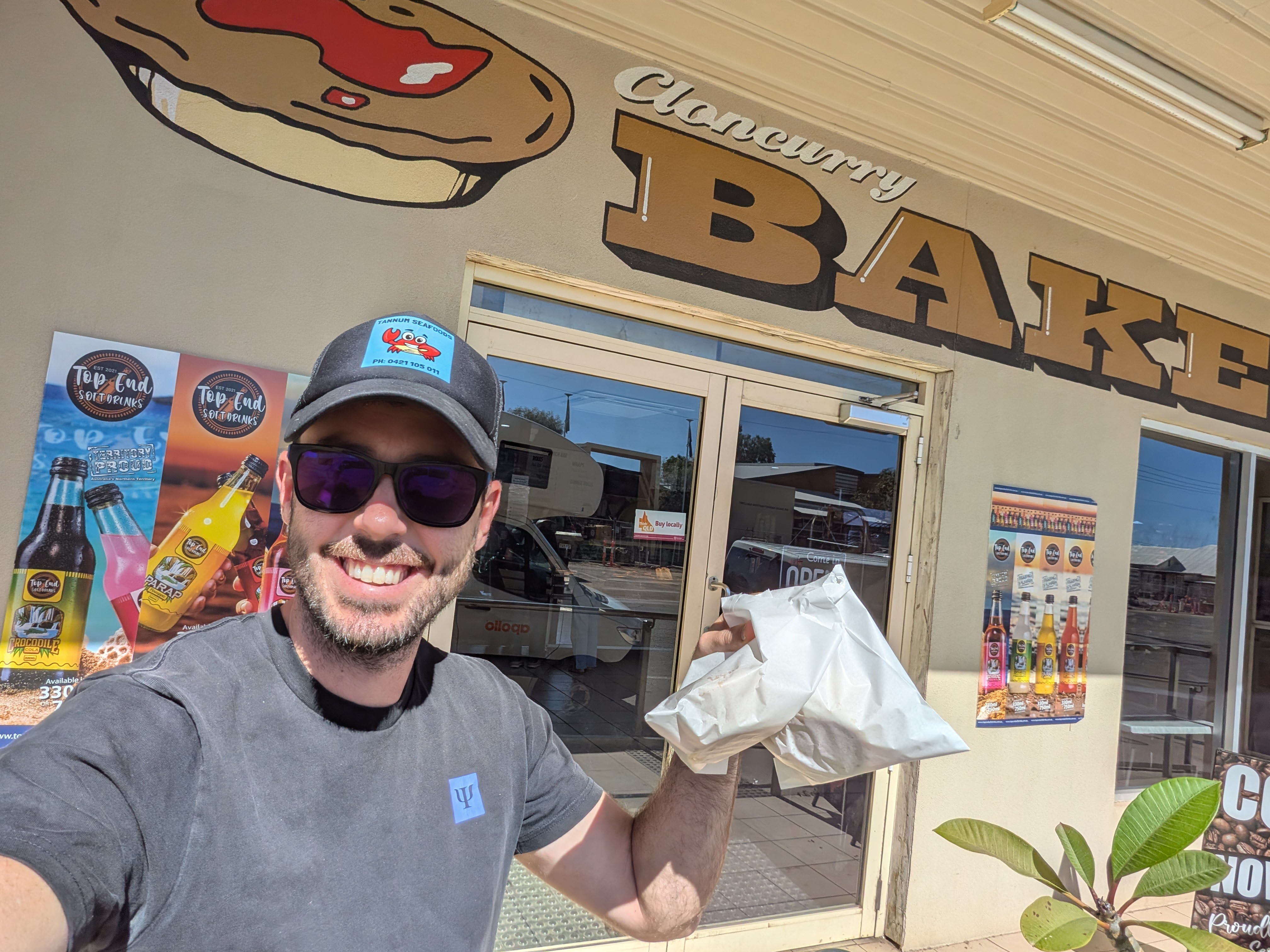 Dylan with a pie from the Cloncurry Bakery