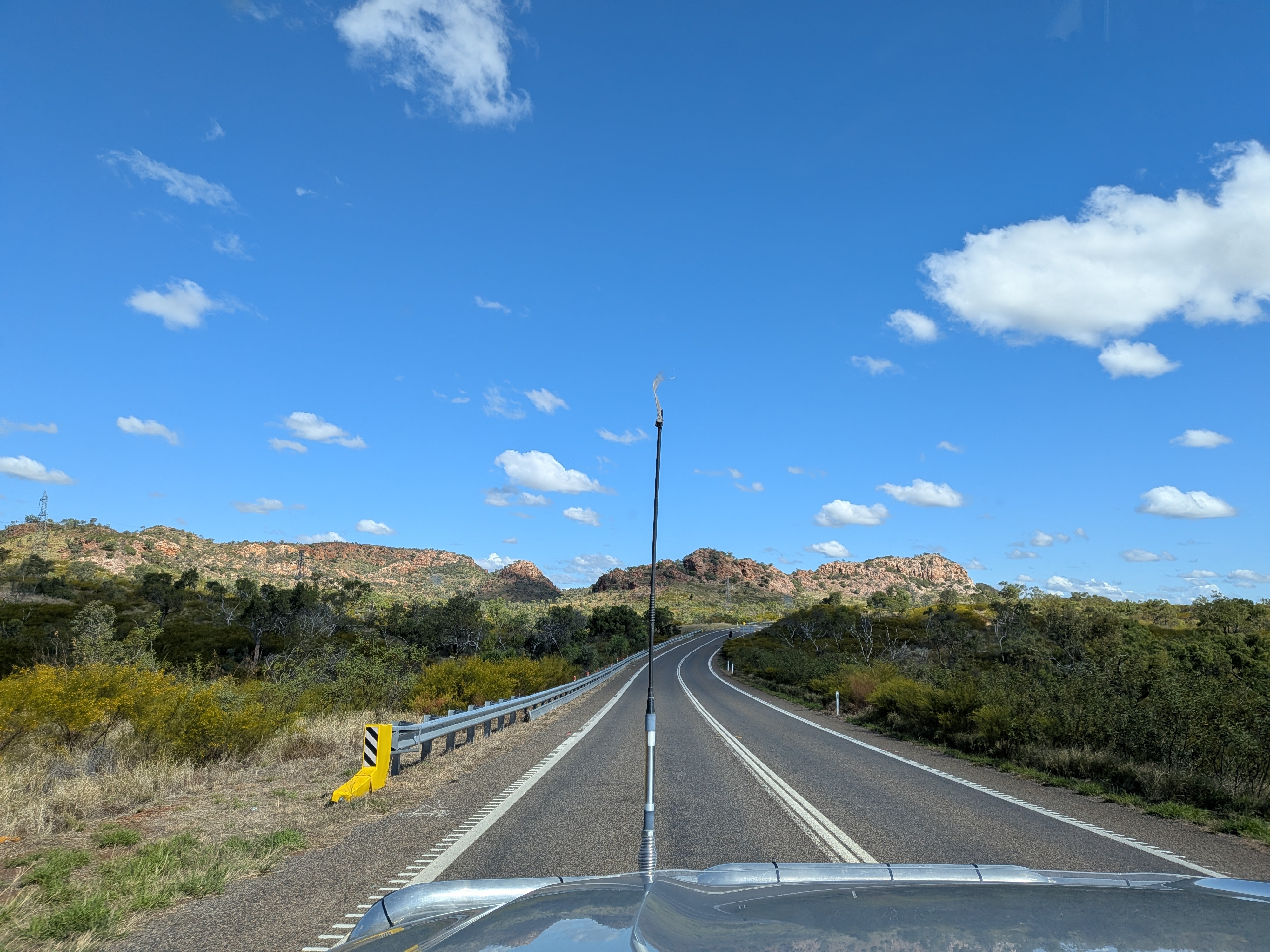 Scenic highway toward Mount Isa through rocky ridges