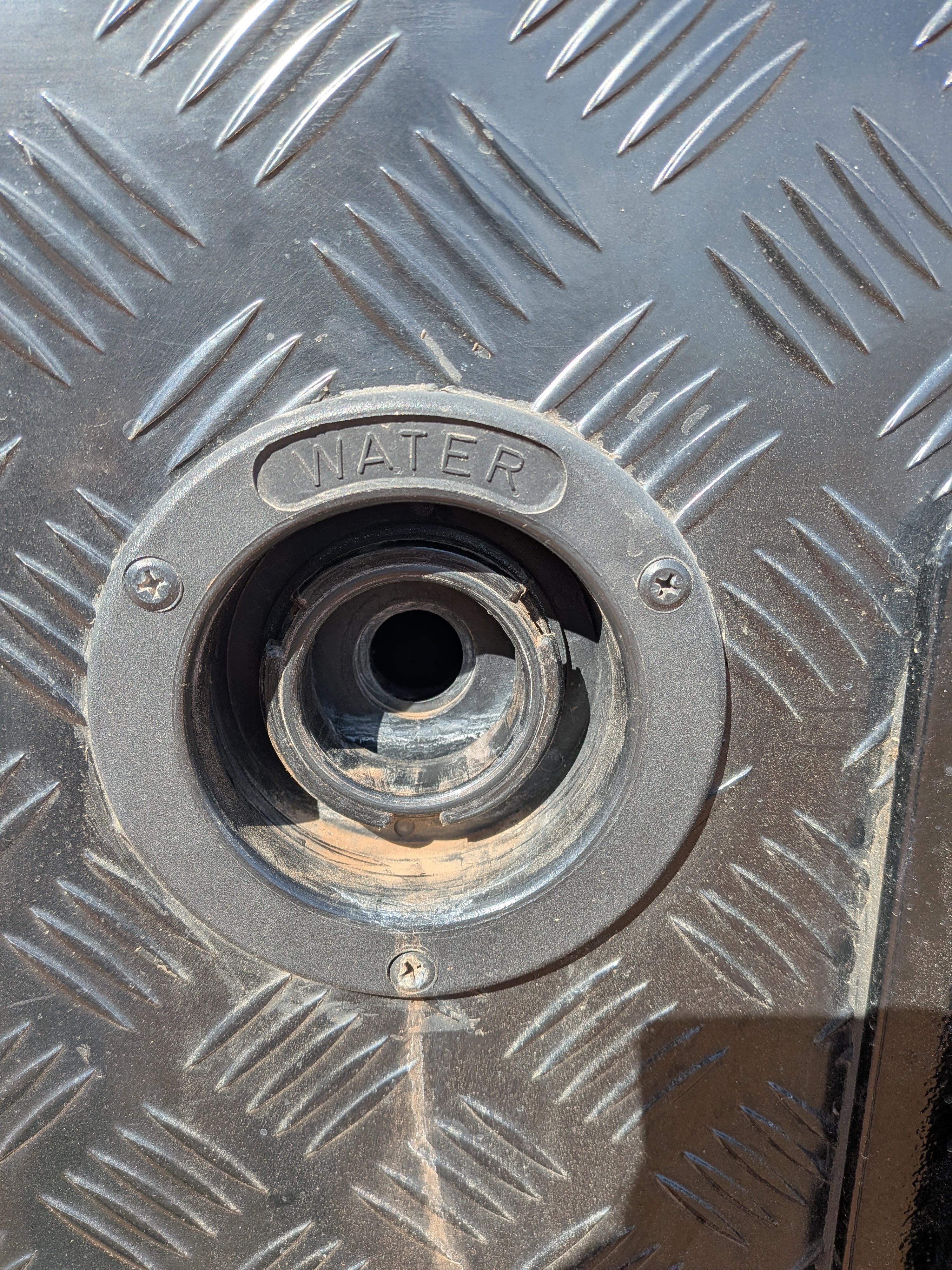 The missing water tank cap — taped up at Camooweal