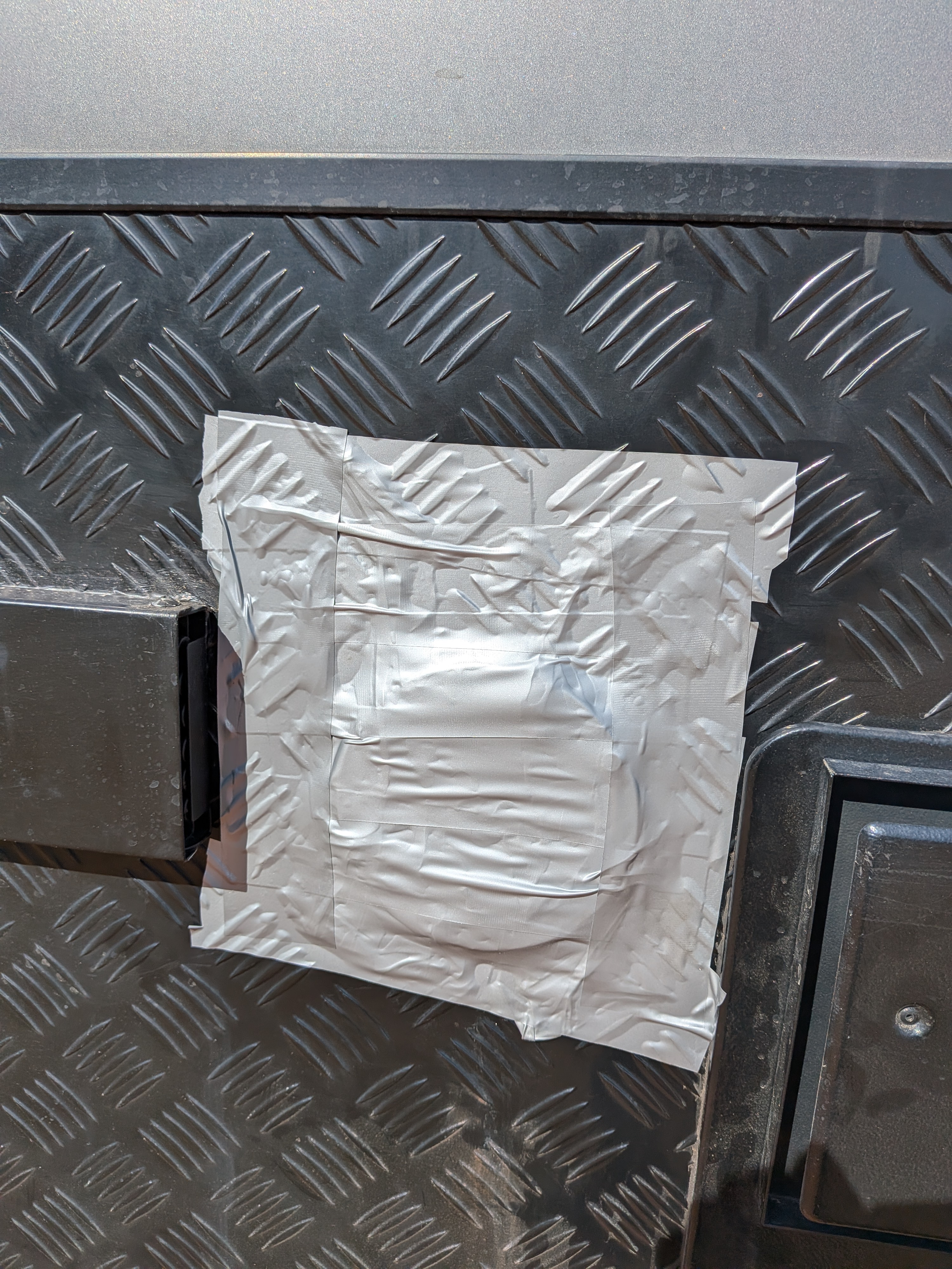 Water tank cap taped over with duct tape