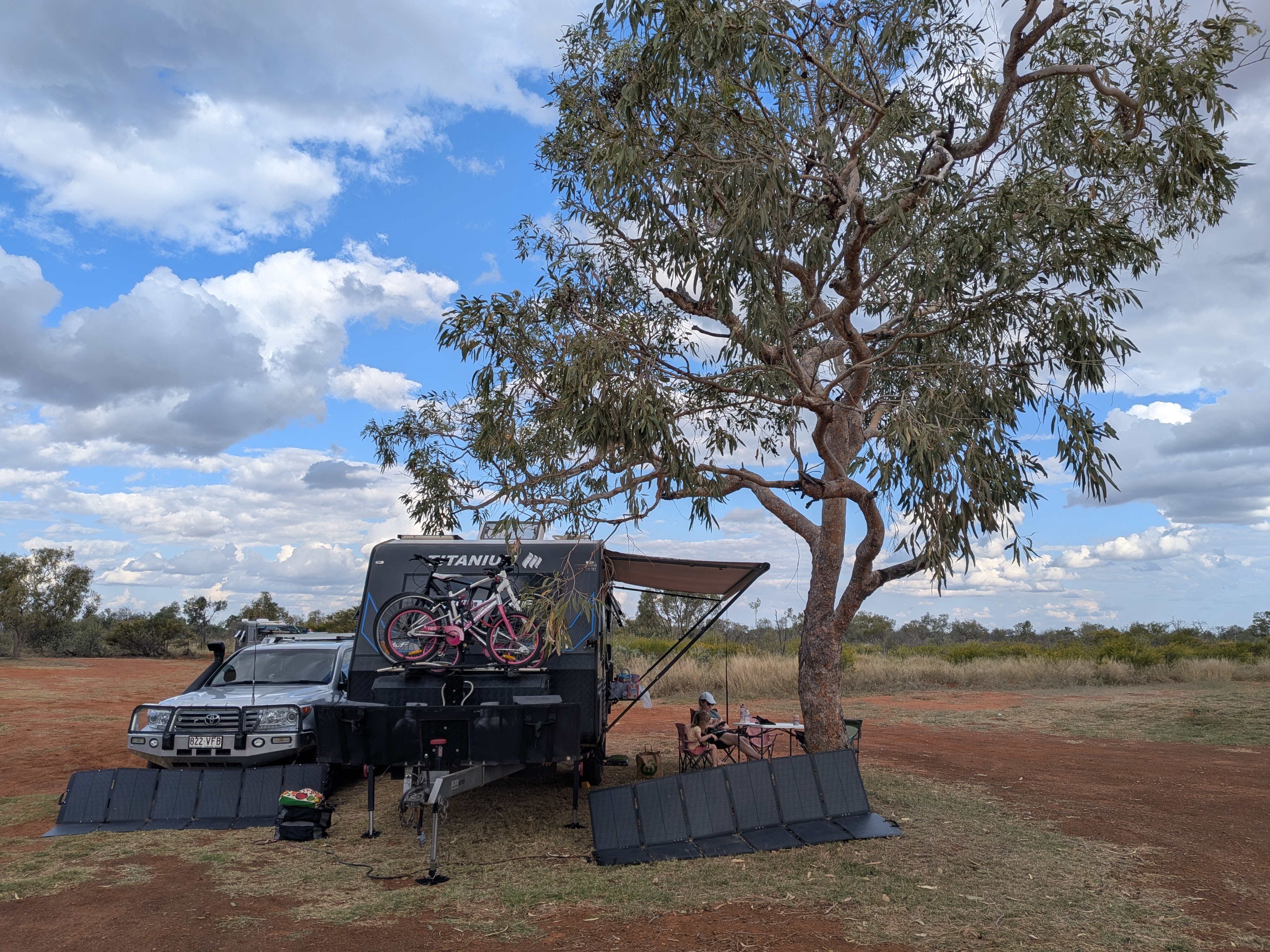 Reg and TITANIUM HARDCORE set up under a tree at Barkly Homestead with solar panels out